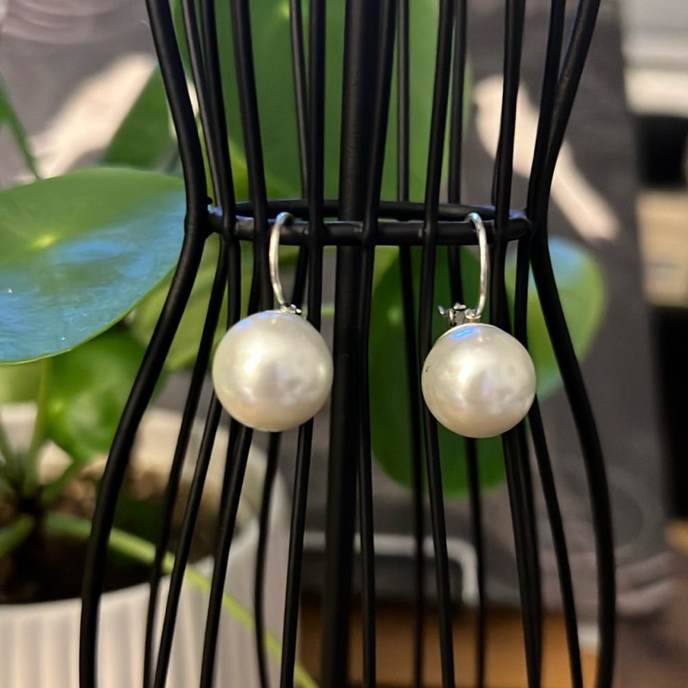 Pearl Earrings set in silver tone with no stamp that I can see.